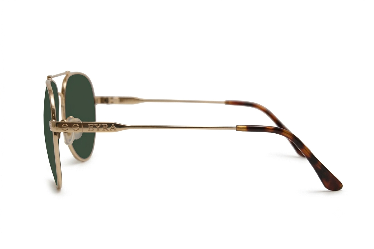 Sunglasses with tortoiseshell frame and green lenses on a white background