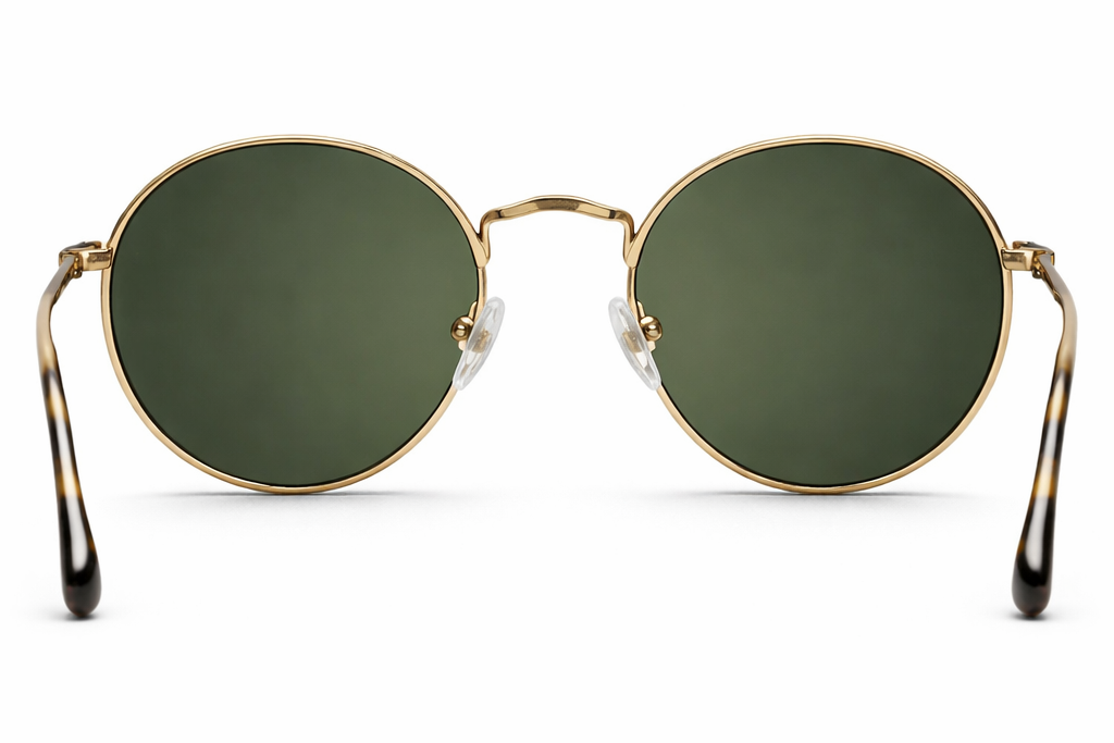 Round sunglasses with green lenses and gold frames on a white background
