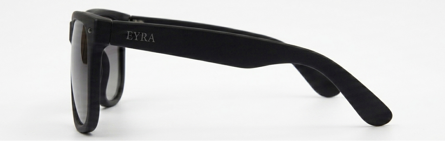 Black sunglasses with 'Zara' branding on a white background
