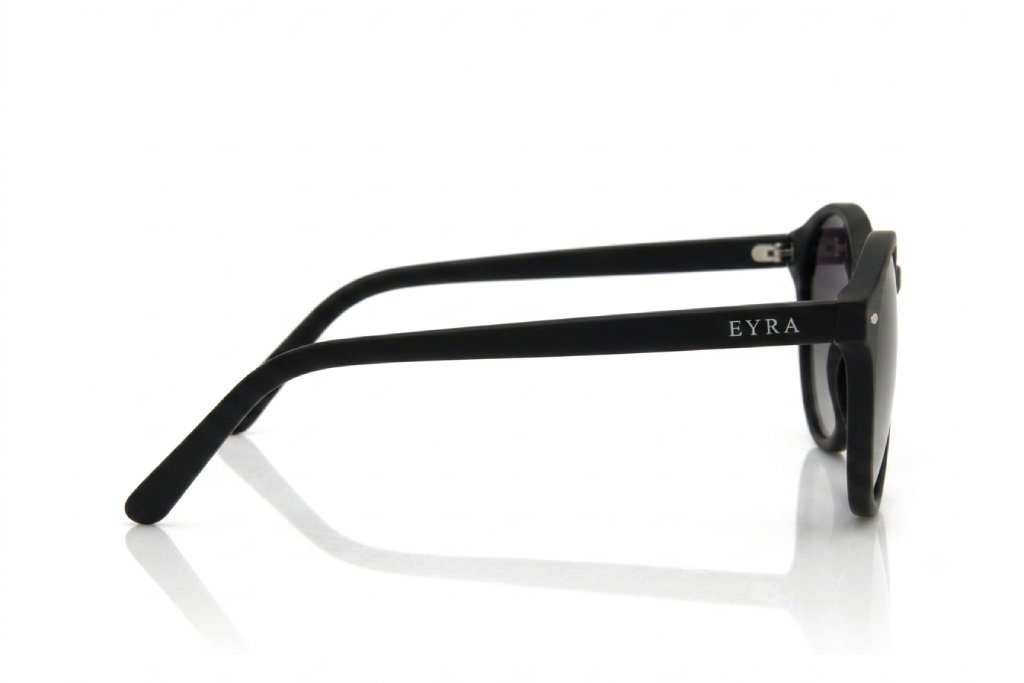 Sunglasses with tortoiseshell frame and dark lenses on a white background