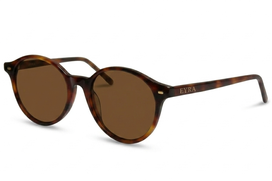 Sunglasses with tortoiseshell frame and brown lenses on a white background