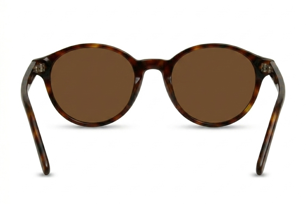 Sunglasses with tortoiseshell frame and brown lenses on a white background