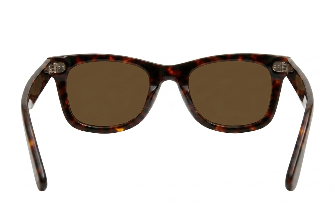 Sunglasses with tortoiseshell frame and brown lenses on a white background